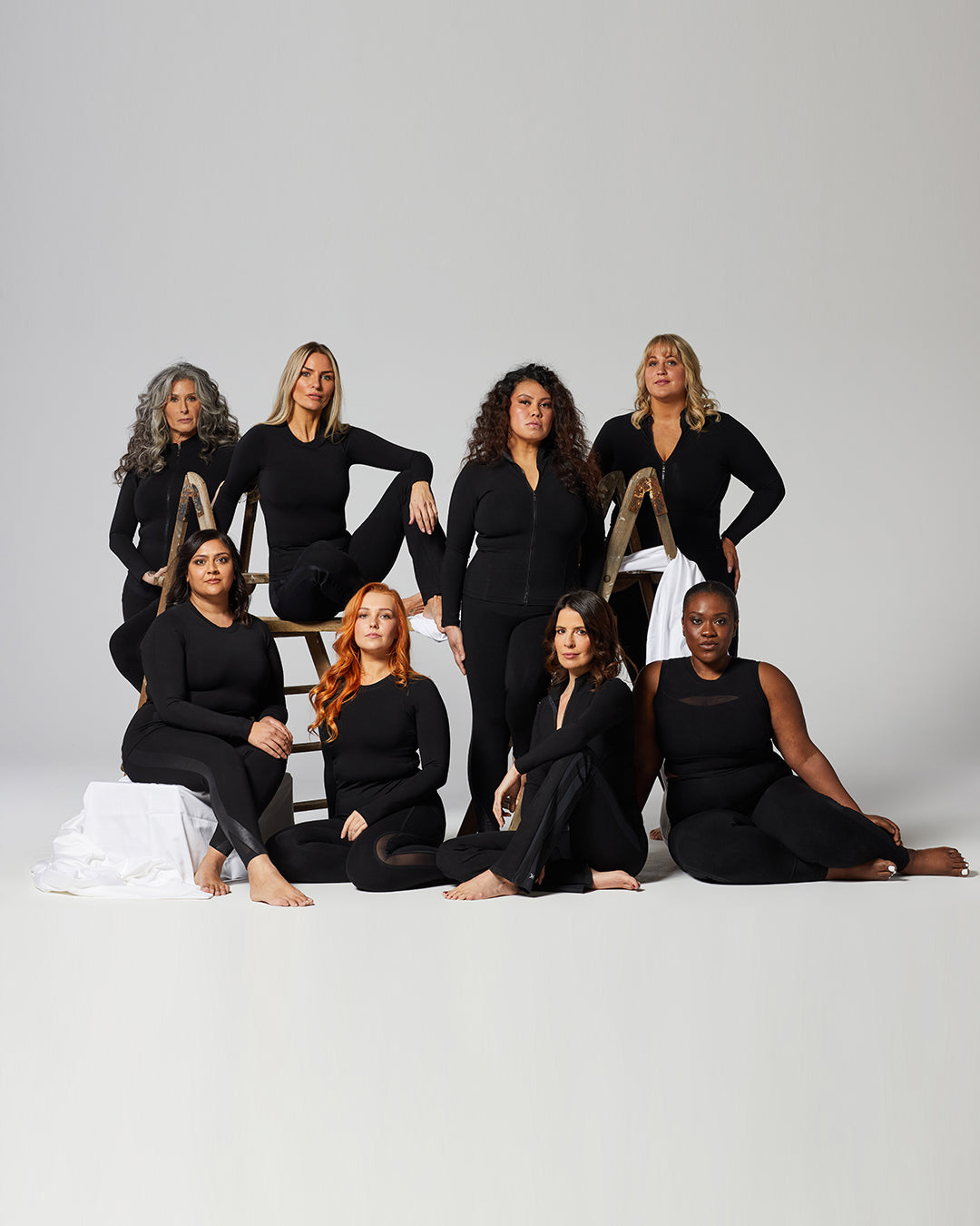 TLC Sport community photographed together in black activewear